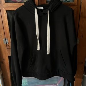 A comfy and warm sweatshirt with a big pocket and a phone pocket